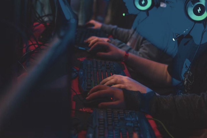 Gamer Playing in Dark Room